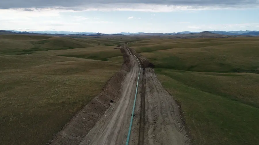 Aerial view of a pipeline right-of-way running across rolling hills