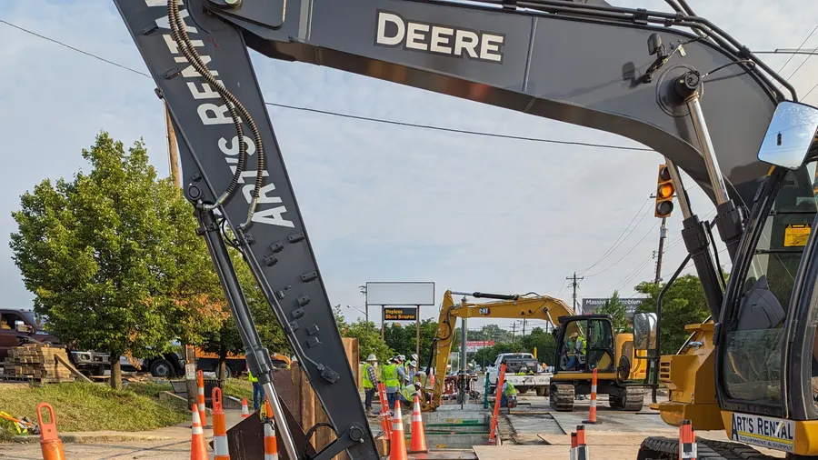A pipeline work zone and traffic control at a road crossing