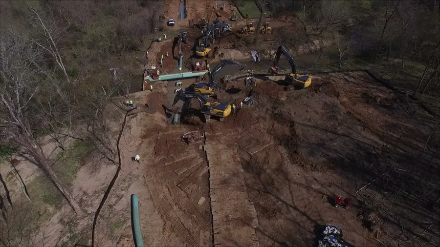 A pipeline crew working a creek crossing